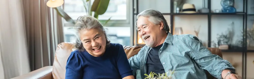 Old couple sitting on a sofa